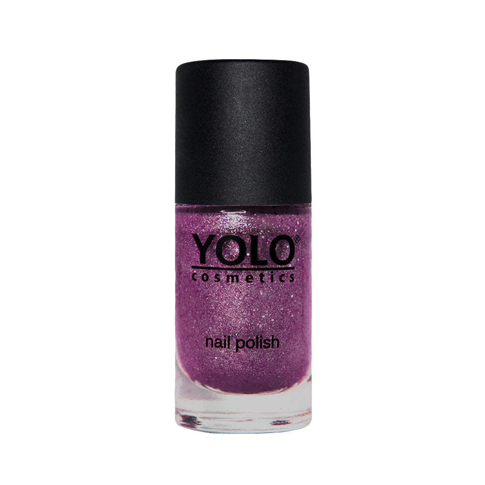 Refect Beauty Yolo glitter nail polish in a vibrant purple shade with a glossy finish in a glass bottle.