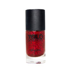 Refect Beauty Yolo red glitter nail polish in a glass bottle with a black cap for a sparkling manicure finish.