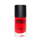 Refect Beauty Yolo creamy red nail polish in a glass bottle with a black cap for a glossy, opaque finish.