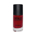Refect Beauty Yolo creamy red nail polish in a glass bottle with a black cap for a glossy, opaque manicure finish.