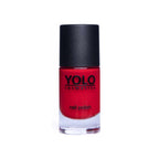 Refect Beauty YOLO nail polish in a vibrant red shade with a high-gloss finish in a clear glass bottle.