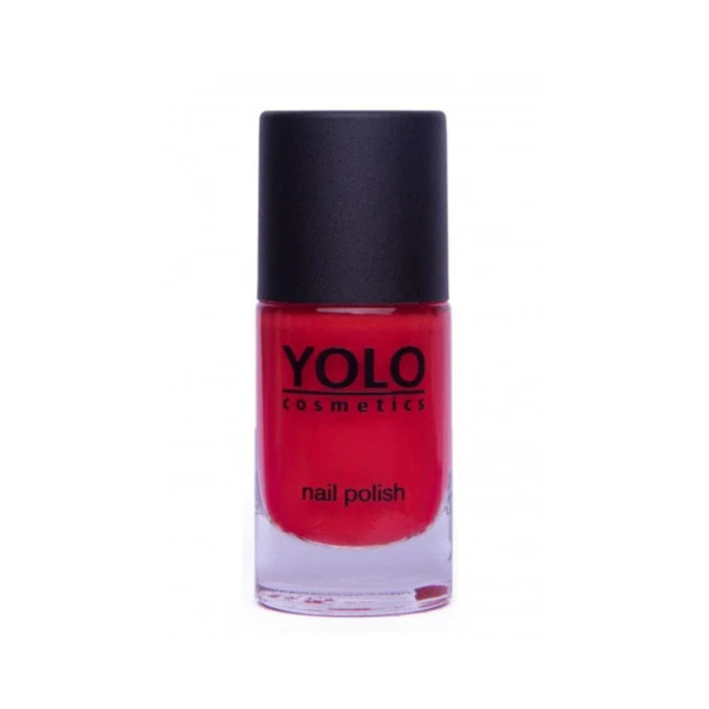 Refect Beauty YOLO nail polish in a vibrant red shade with a high-gloss finish in a clear glass bottle.