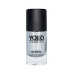 Refect Beauty Yolo silver glitter nail polish in a clear glass bottle with a black cap.