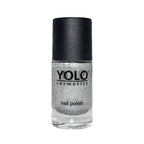 Refect Beauty Yolo silver glitter nail polish in a clear glass bottle with a black cap.