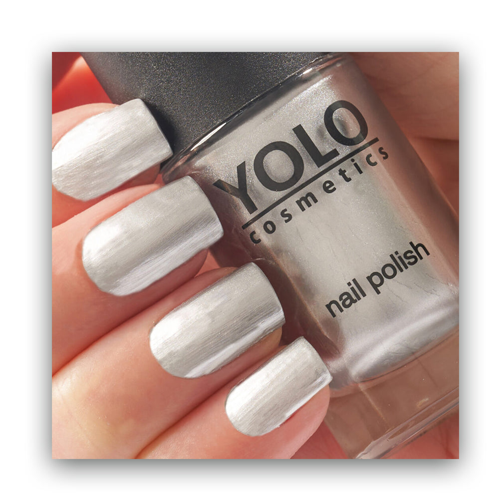 Refect Beauty Yolo mirror nail polish in a metallic silver shade with a high-shine reflective finish on fingernails.