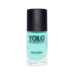 Refect Beauty Yolo Nail Polish in a vibrant creamy turquoise shade with a sleek black cap in a glass bottle.