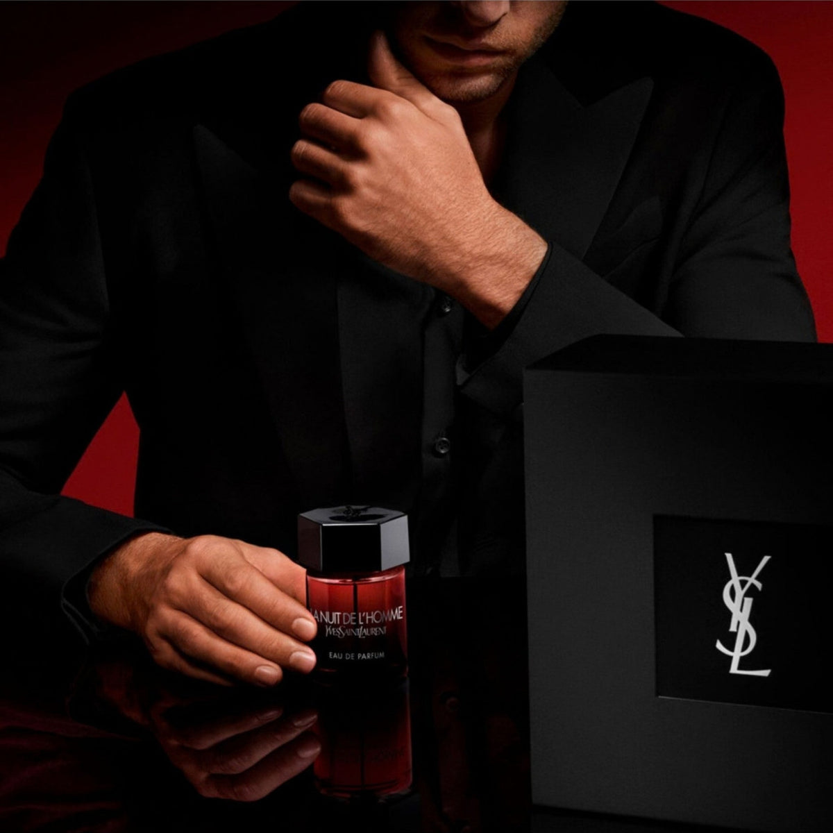 Refect Beauty Yves Saint Laurent La Nuit De L'Homme Eau de Parfum bottle with a man in a black suit on a red background