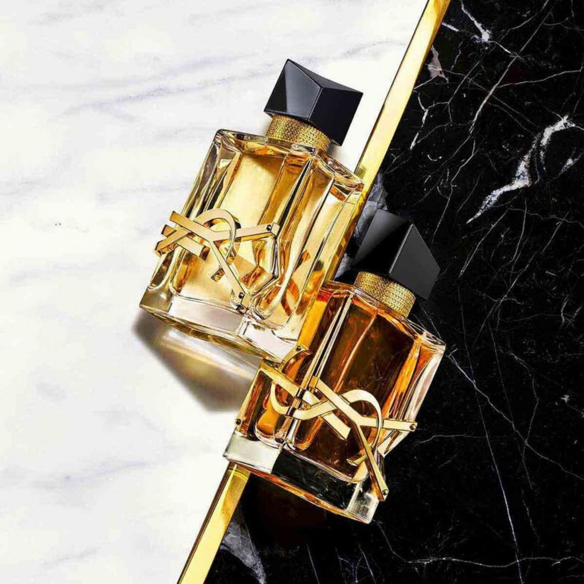Refect Beauty Yves Saint Laurent Libre Eau de Parfum Intense bottles on a black and white marble surface
