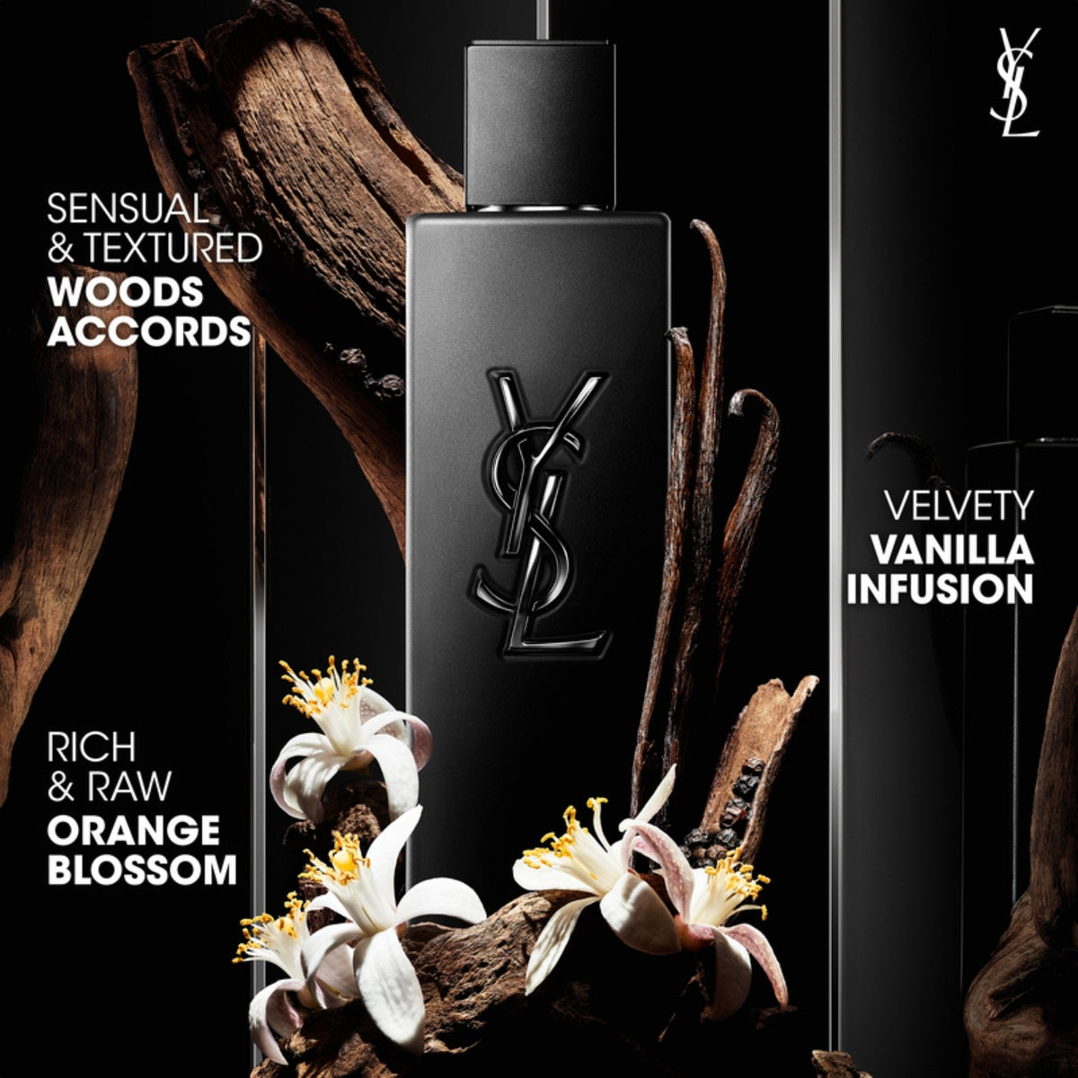 Refect Beauty Yves Saint Laurent Myslf Le Parfum bottle surrounded by orange blossoms, vanilla beans, and wood accents.