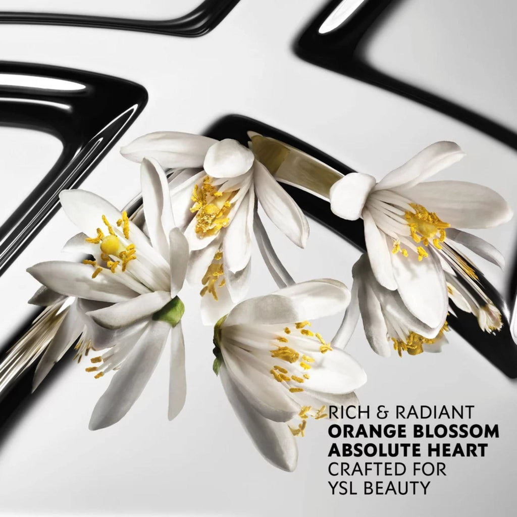 Refect Beauty presents YSL MYSLF fragrance featuring white orange blossom flowers on a reflective black and white surface