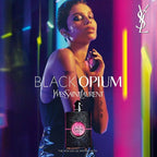 Refect Beauty presents Yves Saint Laurent Black Opium Neon perfume bottle with a model in a vibrant neon nightclub
