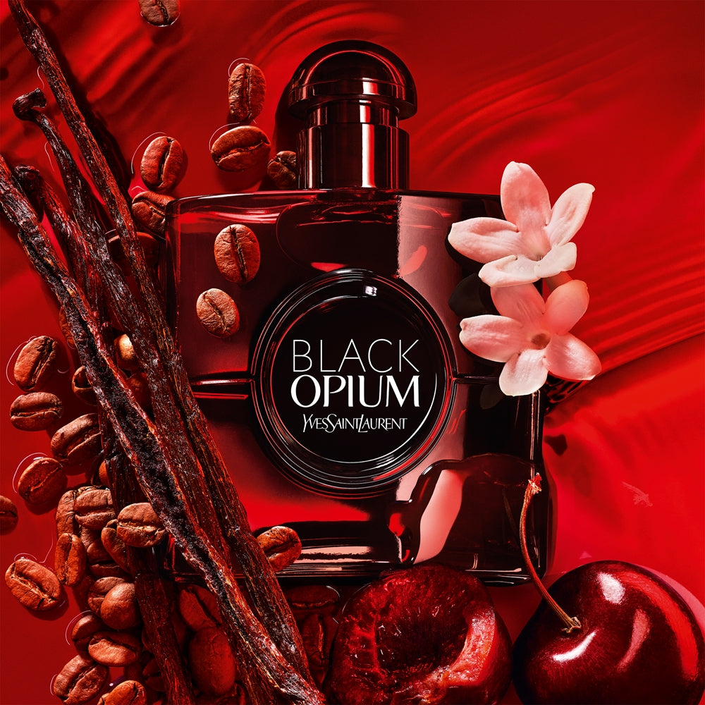 Refect Beauty Yves Saint Laurent Black Opium Over Red perfume bottle surrounded by coffee beans, vanilla, and cherries.