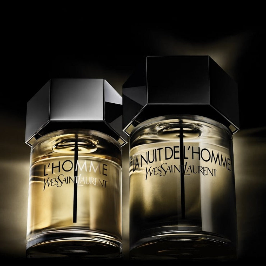 Refect Beauty Yves Saint Laurent La Nuit De L'homme and L'Homme Eau de Toilette glass bottles on a dark background