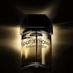 Refect Beauty Yves Saint Laurent La Nuit De L'homme Eau de Toilette bottle with a dark, moody backlit aesthetic.