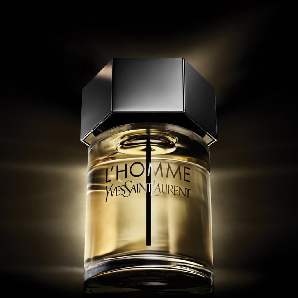 Refect Beauty Yves Saint Laurent L'homme Eau de Toilette glass bottle with a hexagonal black cap against dark background