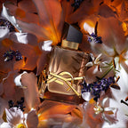 Refect Beauty Yves Saint Laurent Libre Flowers & Flames perfume bottle surrounded by white lilies and lavender sprigs