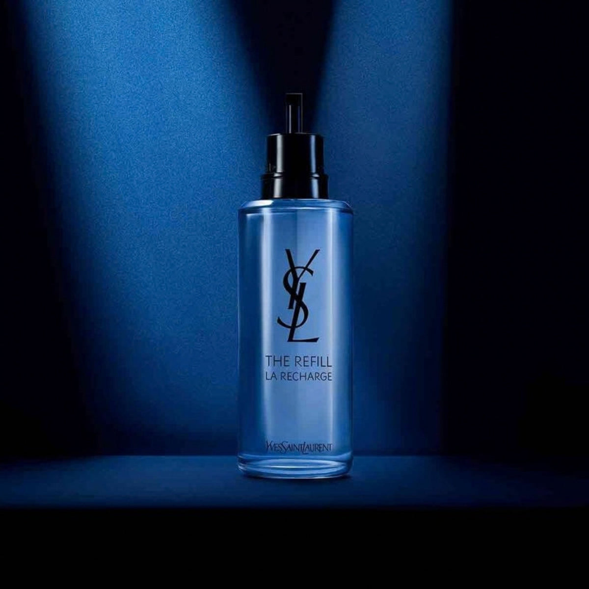 Refect Beauty Yves Saint Laurent Y Eau de Parfum refill bottle in a sleek blue glass container with black pump top.