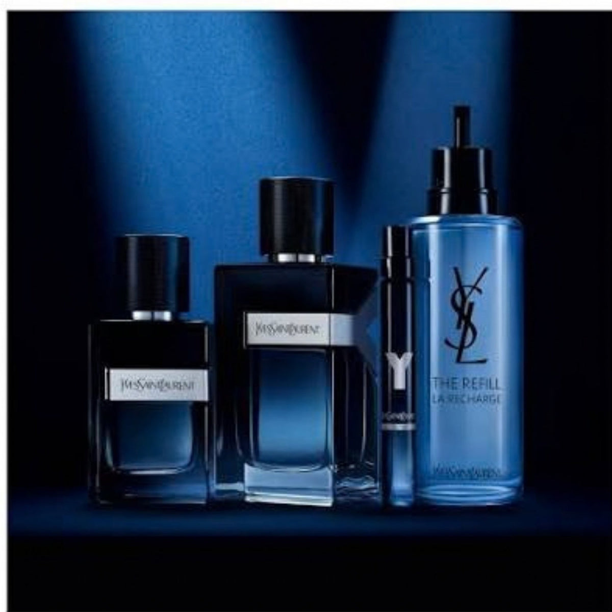 Refect Beauty Yves Saint Laurent Y Eau de Parfum collection featuring glass fragrance bottles and a refill container